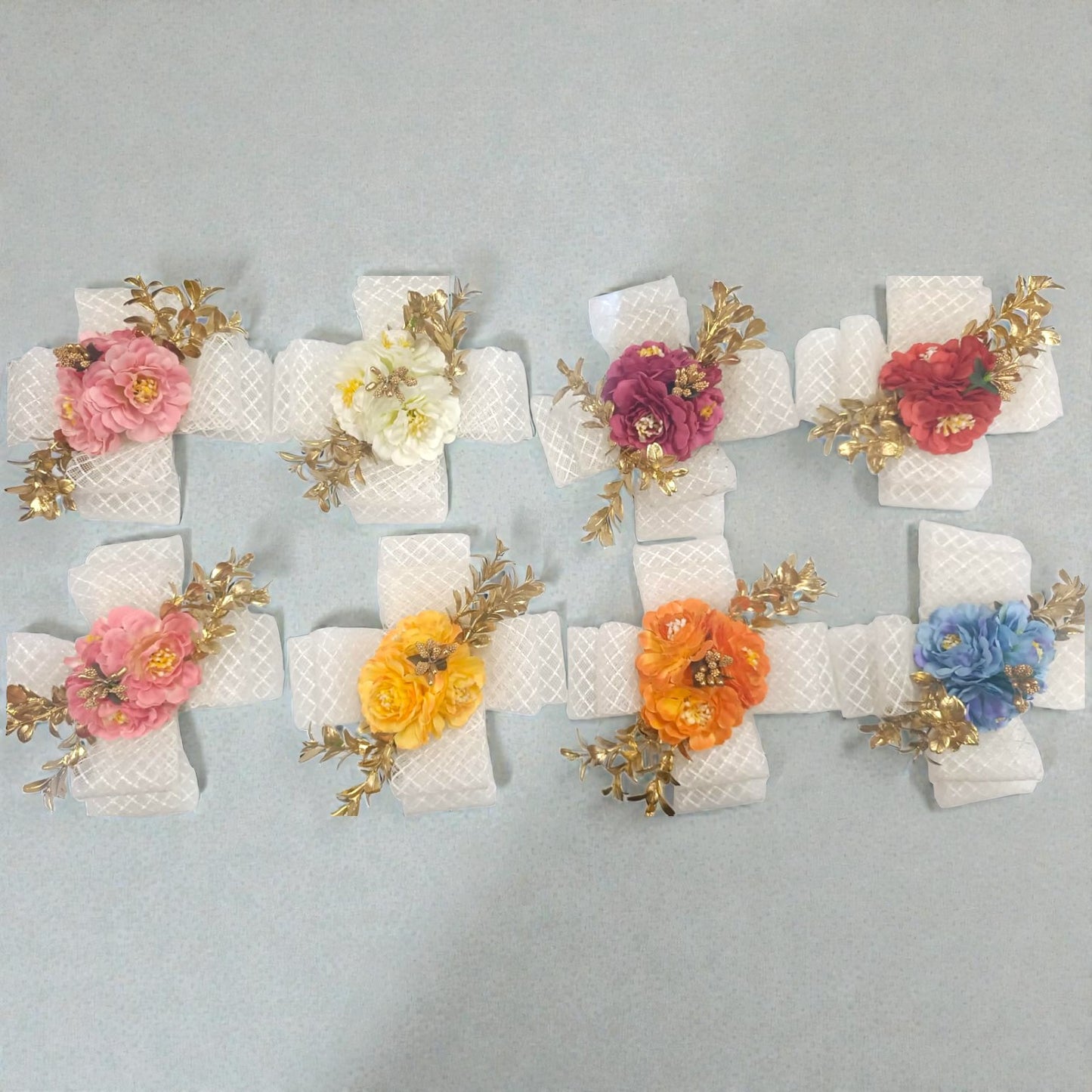 Artificial flower bunch with 3 premium flowers in assorted colors. Ideal for hamper décor, gift packing, saree packing, trousseau trays and festive packaging.