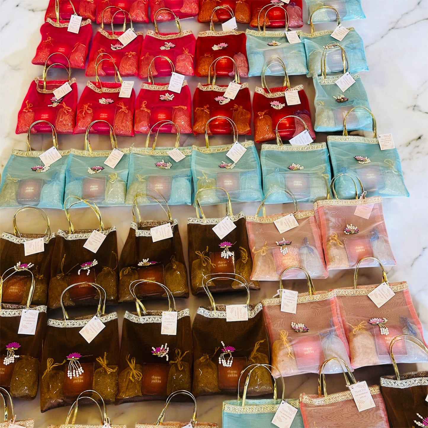 Premium Return Gift Hamper with Almonds, Raisins, Laxmi Charan Paduka Gift Box in Lotus Decorated Tissue Bag