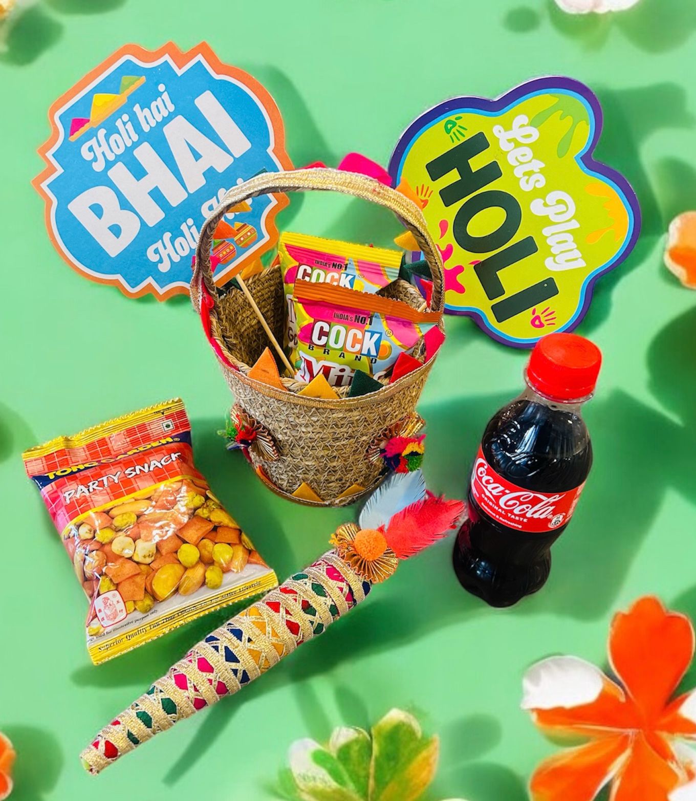 Holi Hamper with Mini Gulal, Tong Garden Party Snack, Coke & Decorative Pichkari in a Gift Basket | Holi Gift Pack