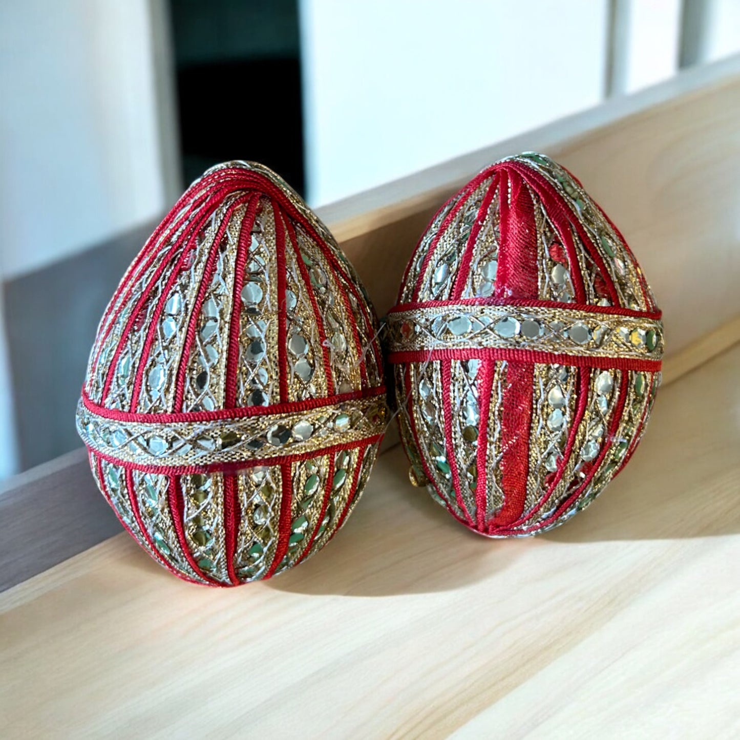 Dry coconut (sookha nariyal) decorated with orange lace for pooja, wedding rituals, and griha pravesh by Wrap Shap