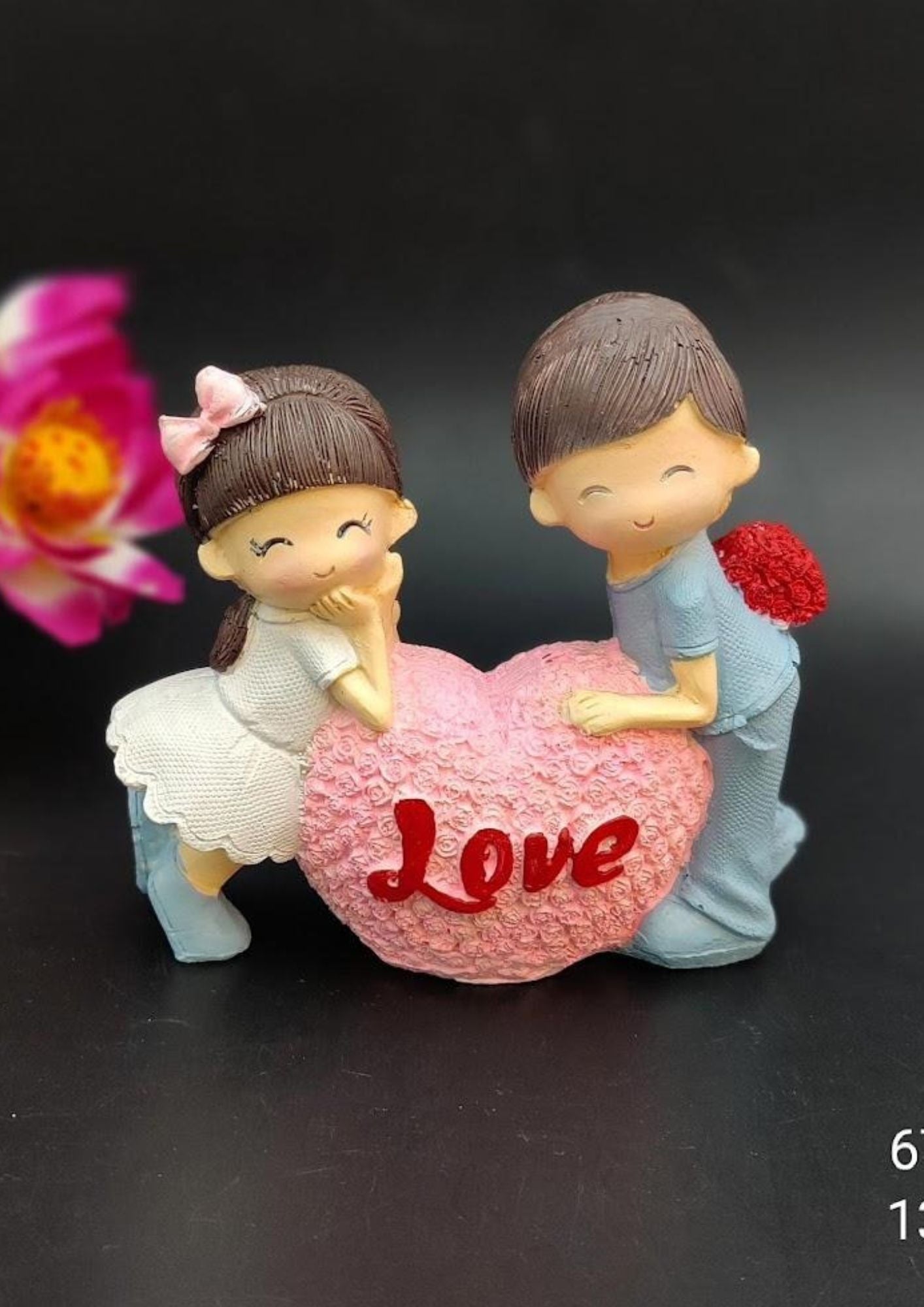 Valentine's Day couple figurine with pink textured heart, featuring girl in white dress and boy with hidden rose bouquet, romantic gift decoration