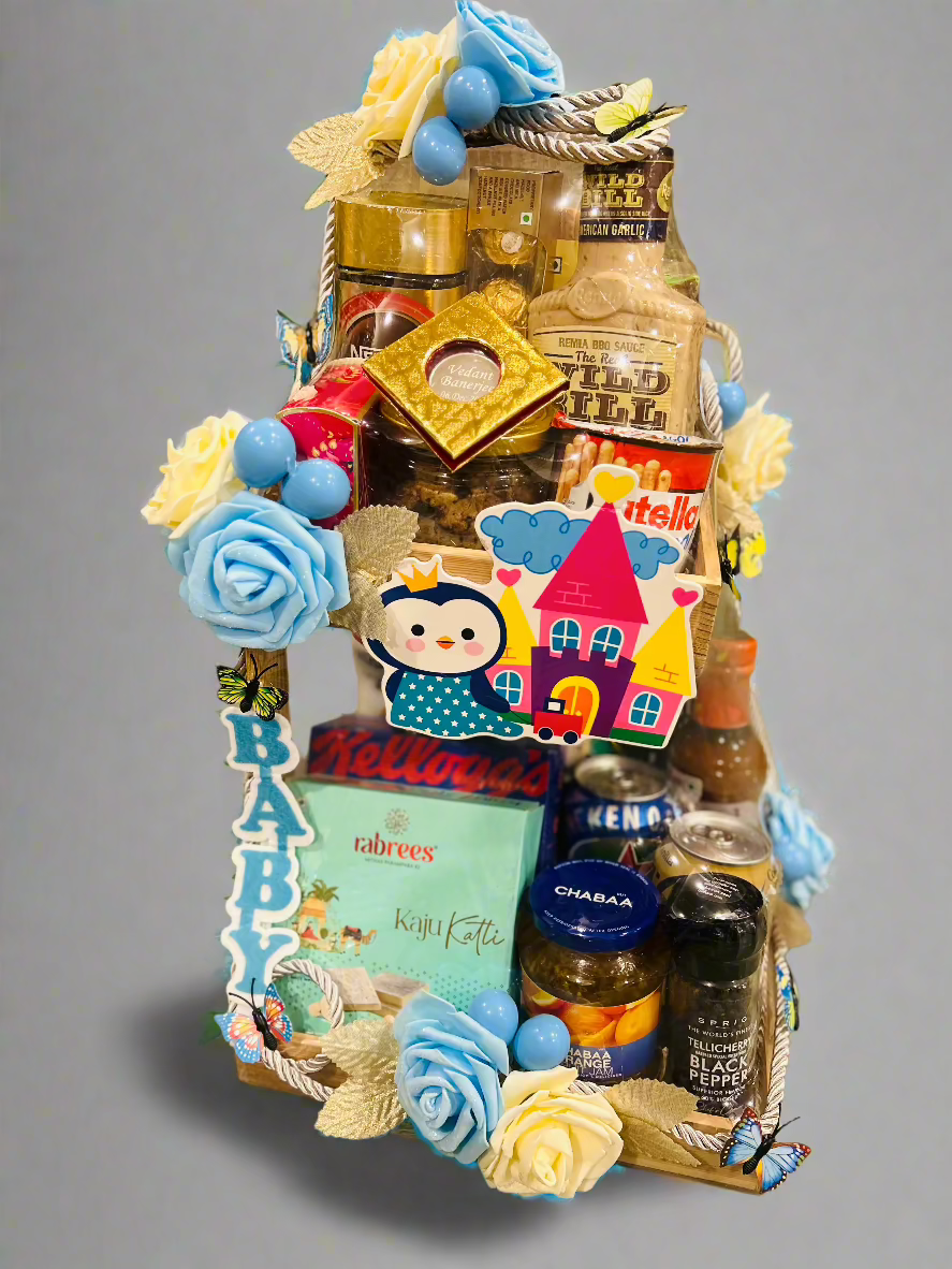 Elegant 2-tier gift basket with imported gourmet treats, Ferrero Rocher, dry cake, cookies, non-alcoholic Heineken, BBQ sauce, and a personalized 10g silver coin for newborn celebrations & birthdays.