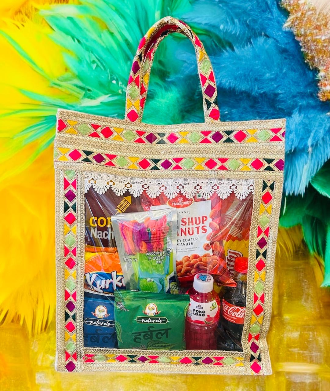 Holi Celebration Gift Hamper – Gulal, Snacks, Drinks & Holi T-Shirt in a Decorative Jute Bag