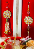 Premium Bhaiya Bhabhi rakhi lumba set with kundan work, beads, and matching festive packaging from Wrap Shap