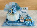 Decorative Baby Boy Gift Hamper with Rasgulla Jar, flowers, and baby-themed items on a wooden platter