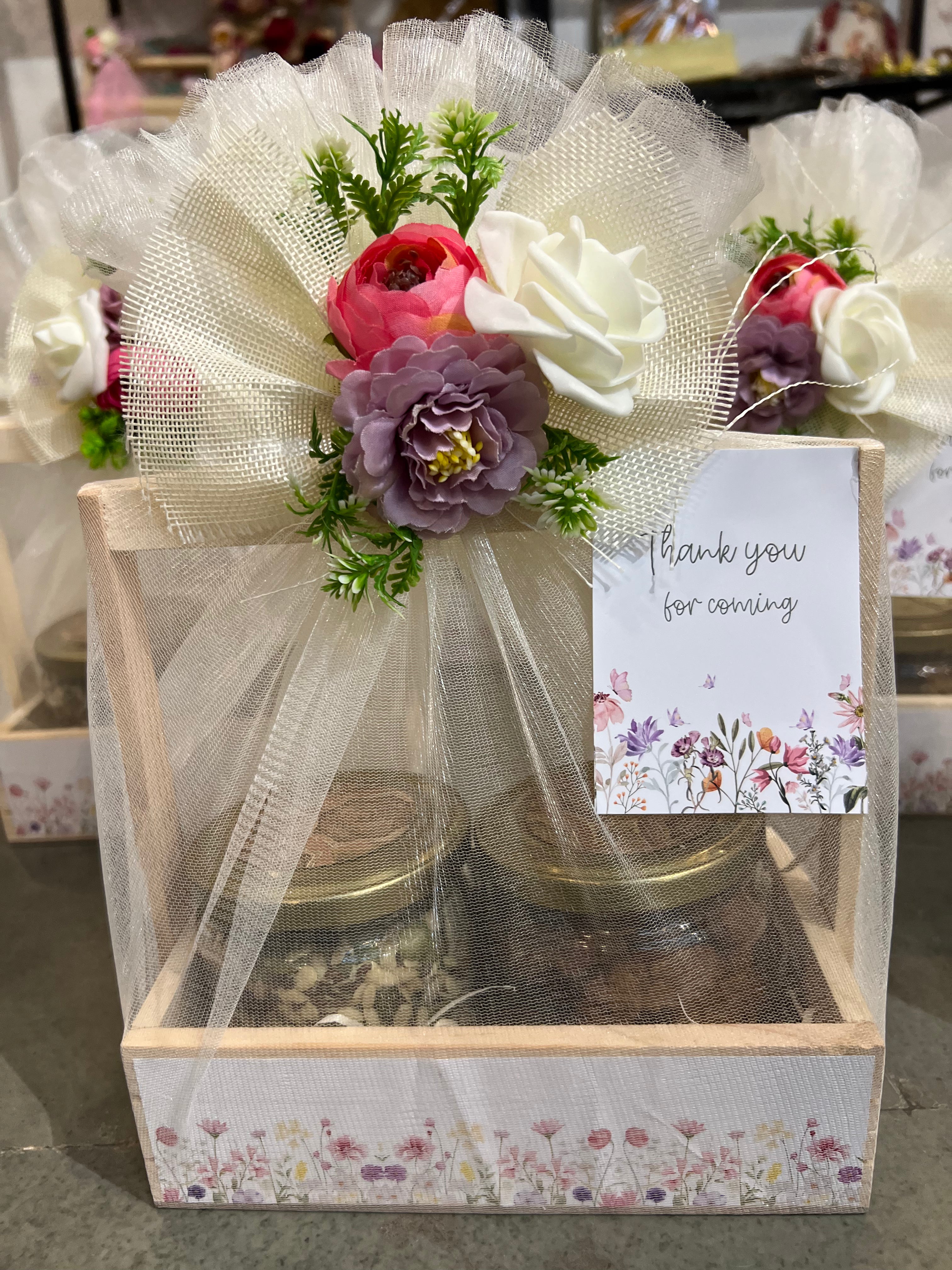 Decorative wooden basket return gift hamper with cookies jar and roasted 5 seeds mix for baby shower and newborn announcement celebrations.