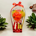 Transparent balloon hamper featuring a customizable message, vibrant roses, Ferrero Rocher chocolates, and a stylish gift box for romantic gifting occasions.