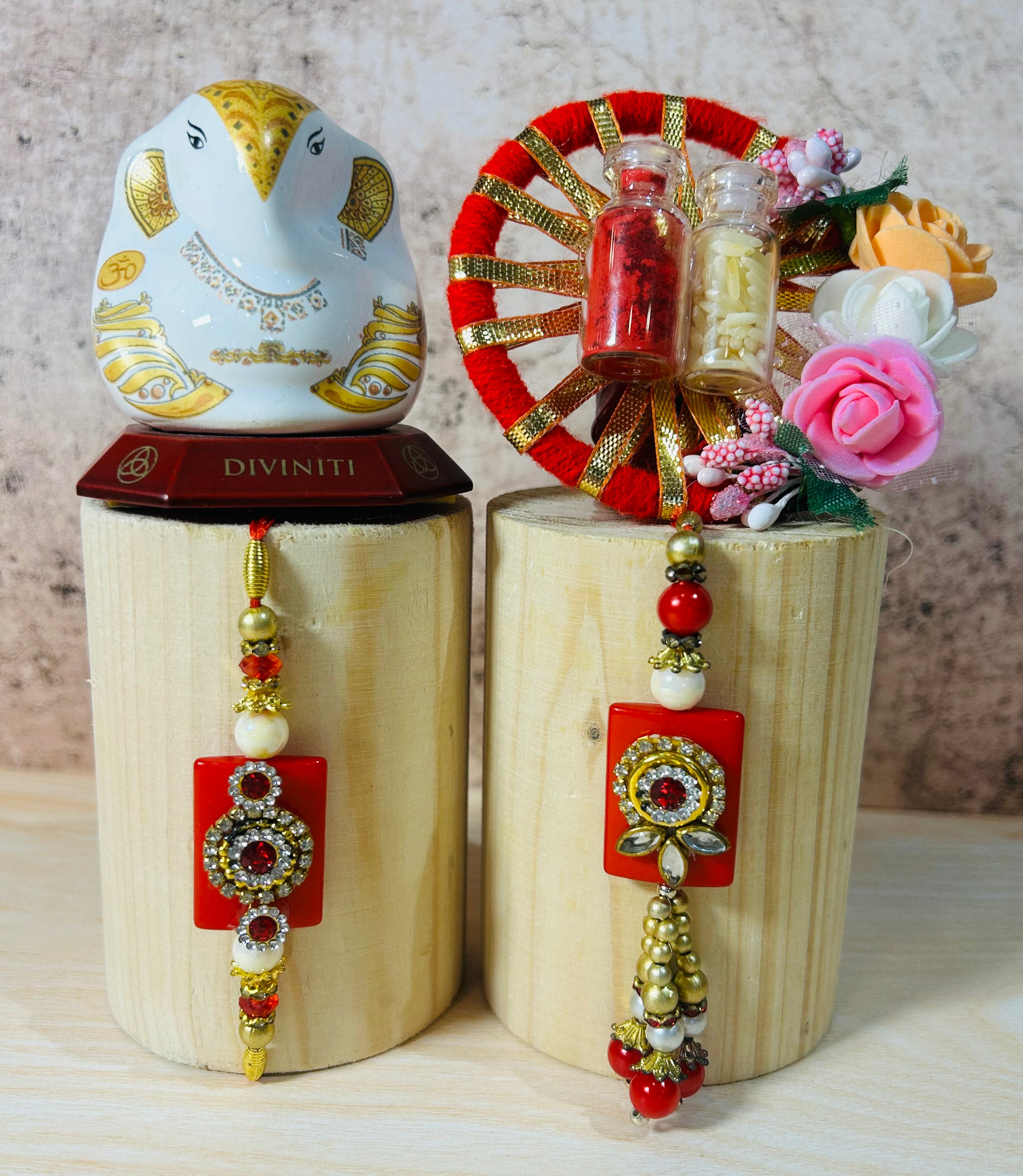 Designer Bhaiya Bhabhi rakhi lumba set with red stones, kundan work, and Nag motifs from Wrap Shap