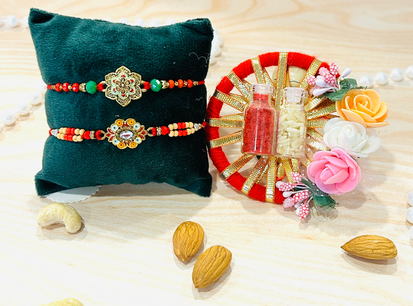 Set of 2 handcrafted rakhis with floral meenakari charm and colorful beads tied on red thread – Wrap Shap Raksha Bandhan collection