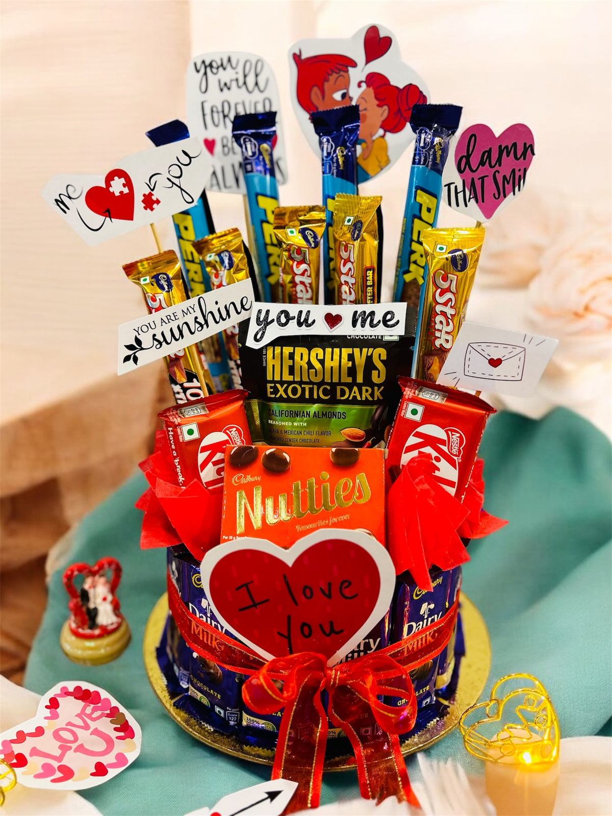 Chocolate bouquet hamper with Dairy Milk base, assorted chocolates, and love quotes, ideal for romantic occasions like Valentine’s Day, birthdays, and weddings.