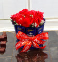 Chocolate cake bouquet hamper featuring Dairy Milk chocolates, roses on top, and custom love quotes for romantic gifting occasions like Valentine’s Day and anniversaries.