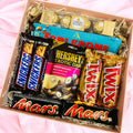 Luxury assorted chocolate gift box with Ferrero Rocher, Toblerone, Snickers, Twix, Mars, and Hershey’s in an elegant gift packaging.