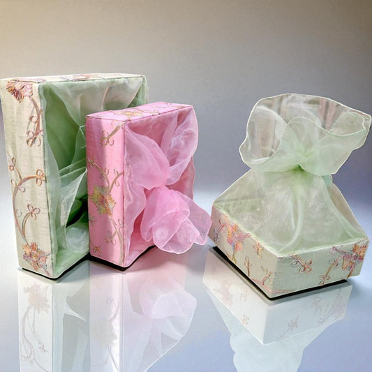 Square fabric gift basket with flower print in assorted colors by Wrap Shap, perfect for festive hampers
