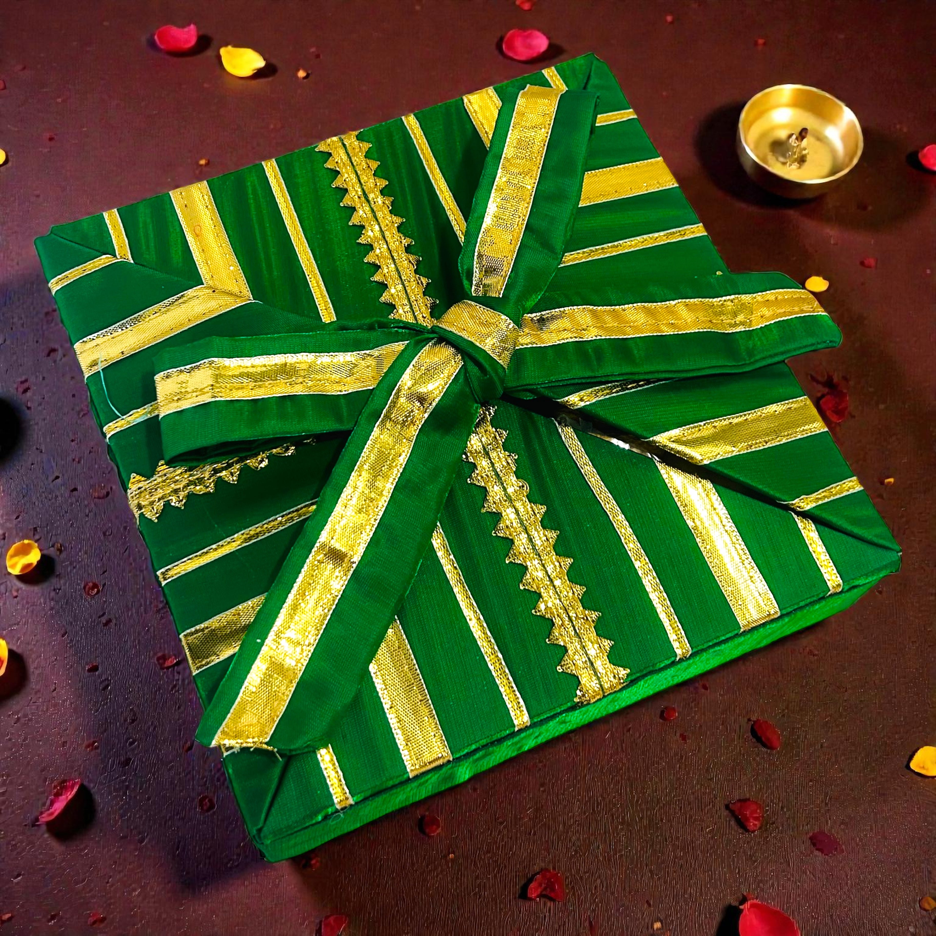 Festive Lohri hamper in a colourful gota-decorated gift box with traditional snacks.