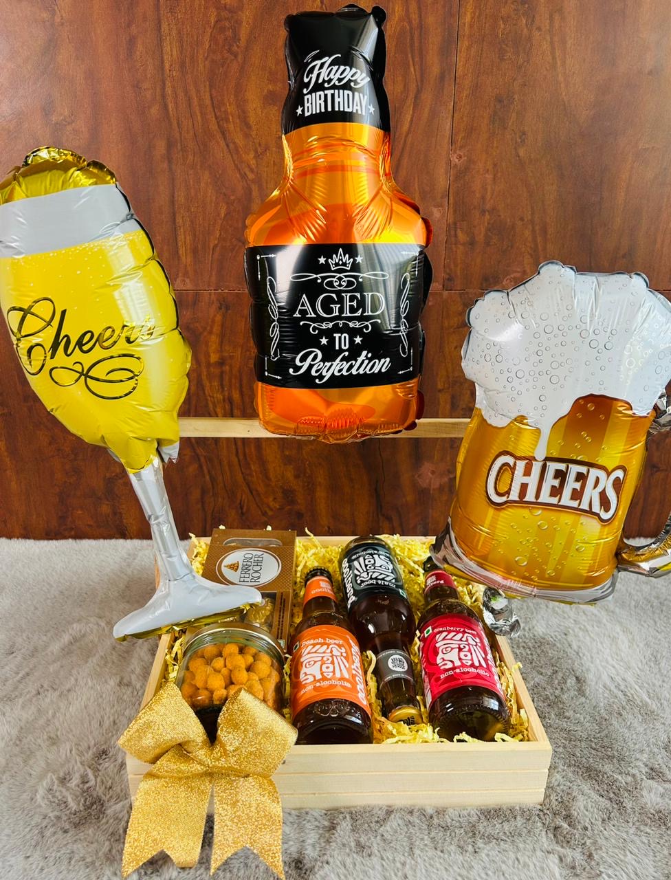 Deluxe Men's Celebration Hamper - Coated Peanuts, Ferrero Rocher Chocolates, Coolberg Drinks, Balloon Decorations in Elegant Basket