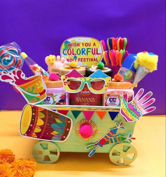 Holi Splash Cart Hamper: Herbal Gulal, Water Balloons, Color Spray, Kids Candies, Banana Chips in Decorated Cart-Style Basket