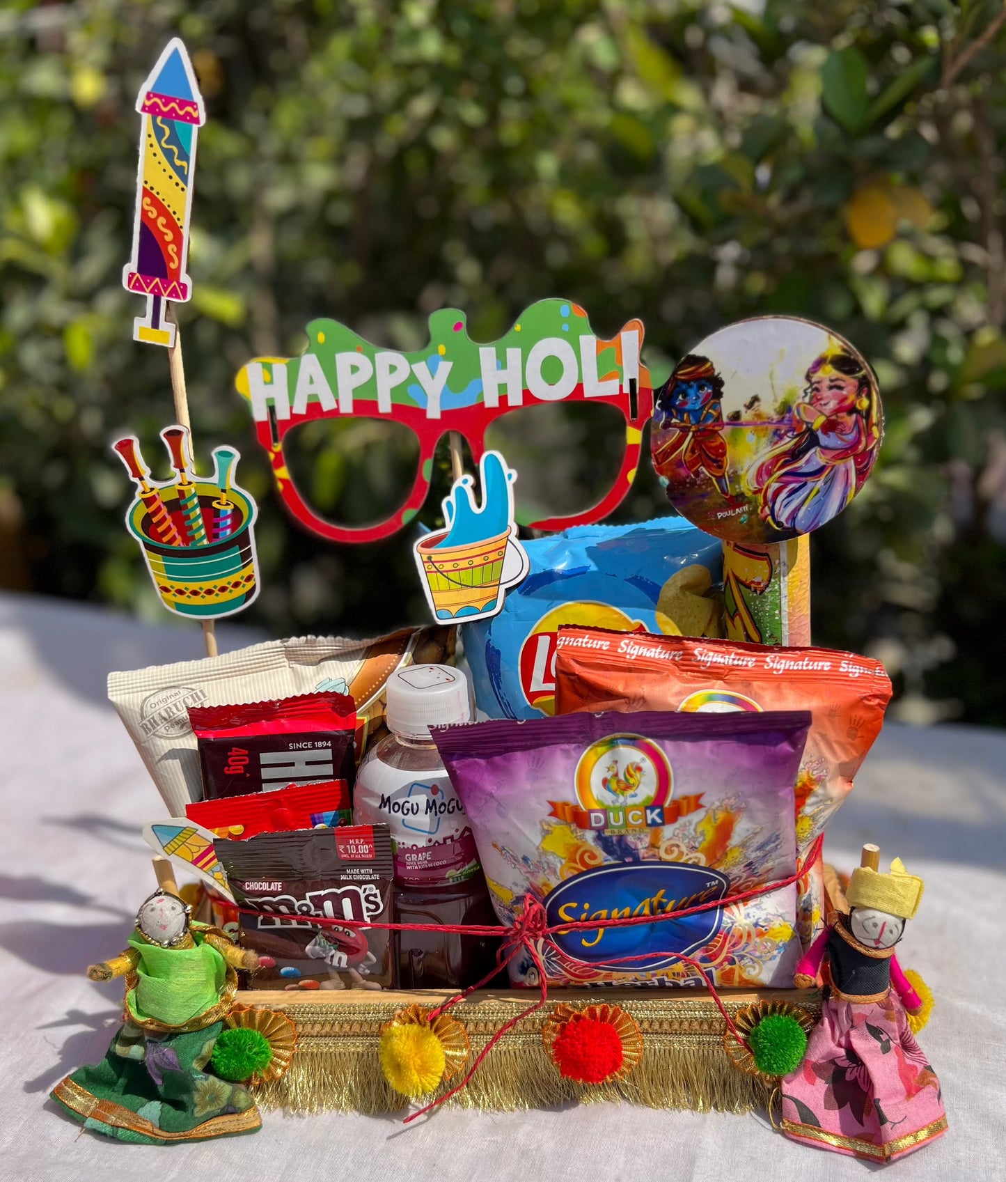 Holi Fiesta Gourmet Hamper: Herbal Gulal, Color Fog & Delectable Treats in Decorated Pinewood Basket