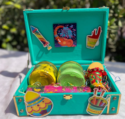 Holi Extravaganza Hamper: Herbal Gulal Jars, Color Shots, and Decorative Pichkari in Decorated MDF Gift Box