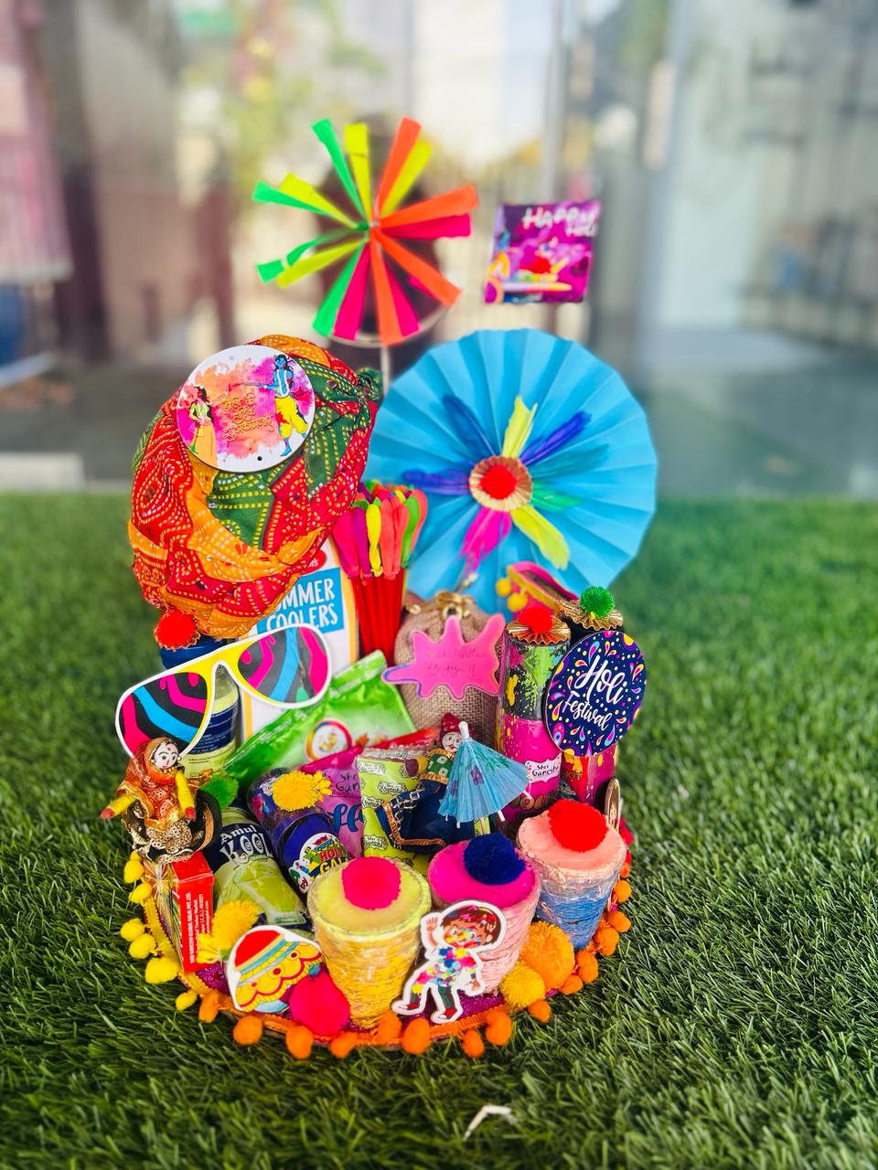 Holi Fiesta Extravaganza: Herbal Gulal, Color Spray, Badam Drink, Candies, Thandai, Coated Dry Fruits in Decorated Tray with Colorful Fans & Rajasthani Pagdi