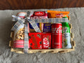 Healthy Indulgence Rakhi Hamper with Makhana, Peanuts, Mixture, Coke, Coconut Water, Yoga Bar & Chocolates in a Decorated Wooden Basket