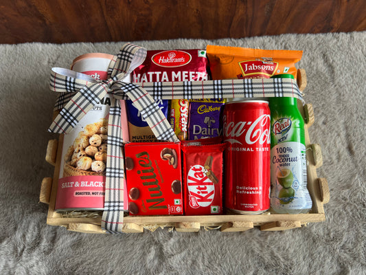 Healthy Indulgence Rakhi Hamper with Makhana, Peanuts, Mixture, Coke, Coconut Water, Yoga Bar & Chocolates in a Decorated Wooden Basket