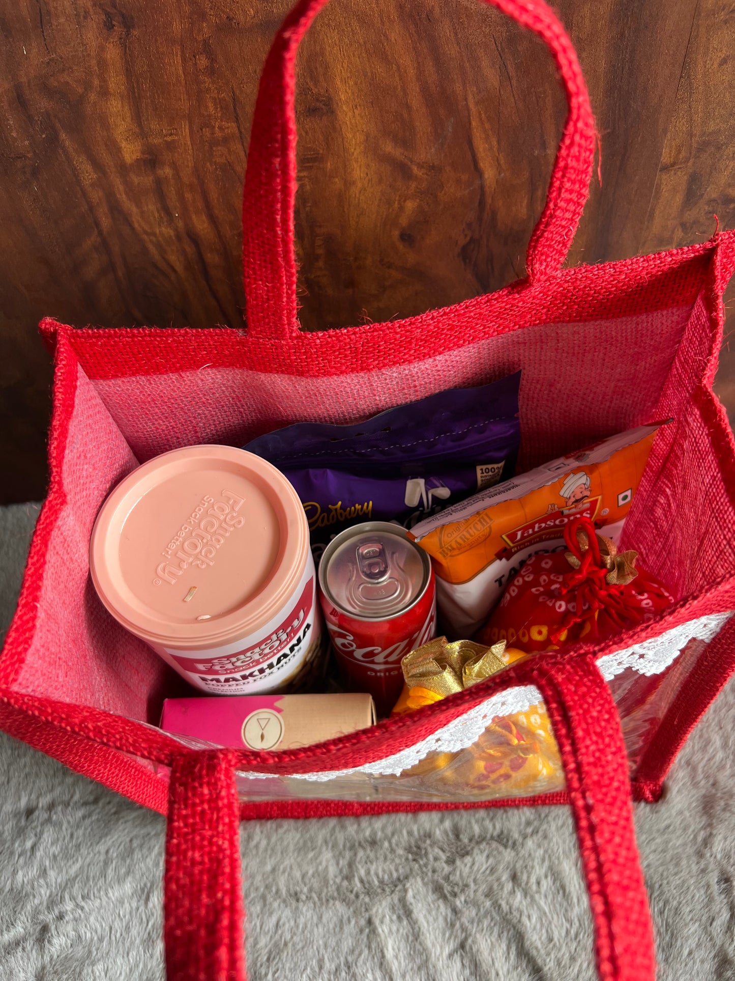 Divine Indulgence Room Hamper with Makhana, Peanuts, Coke, Incense Cones, Coated Almonds & Chocolates