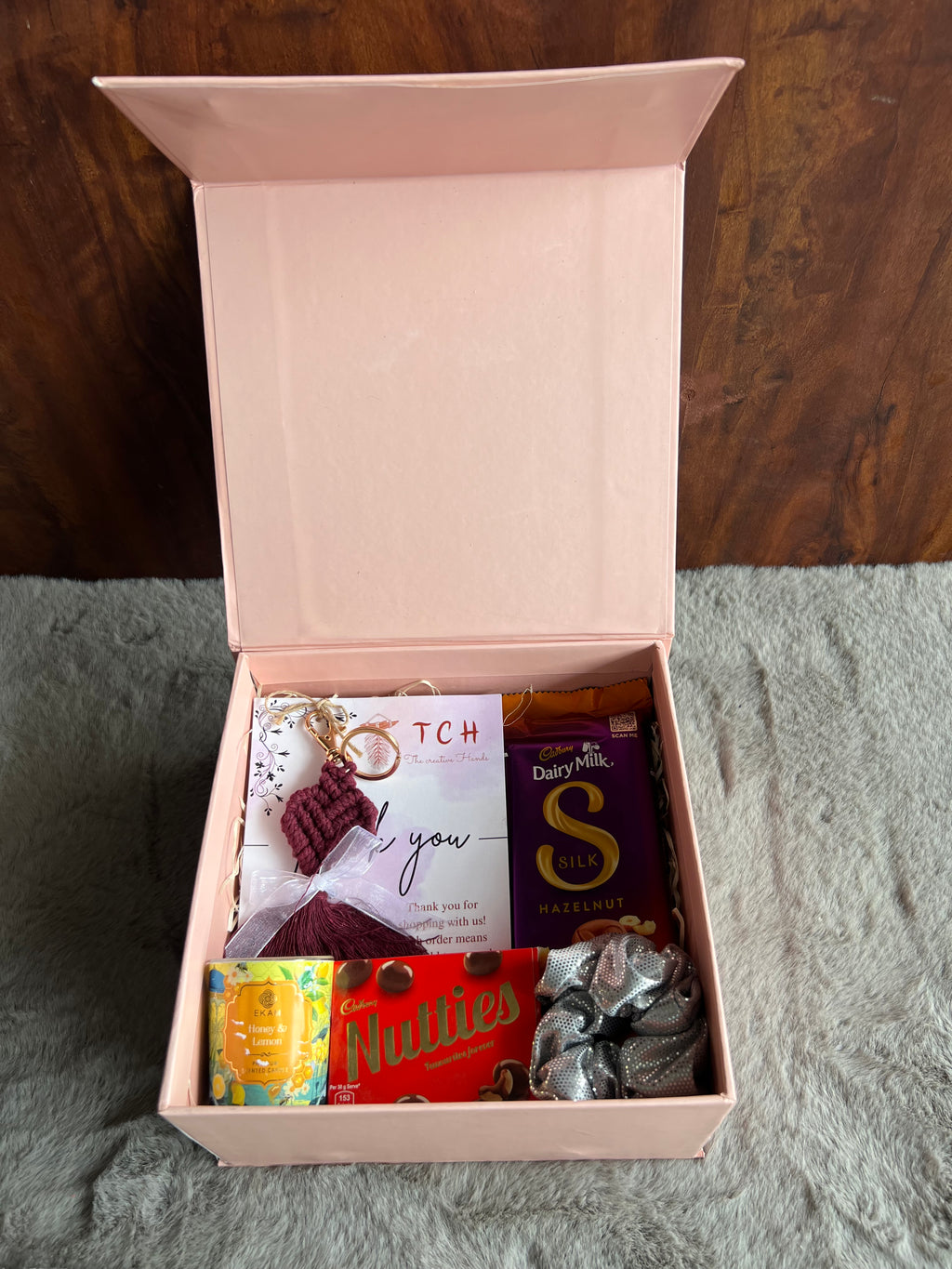 Chic Sister Rakhi Hamper with Crochet Keychain, Candle, Scrunchy & Chocolates in a Stylish Gift Box