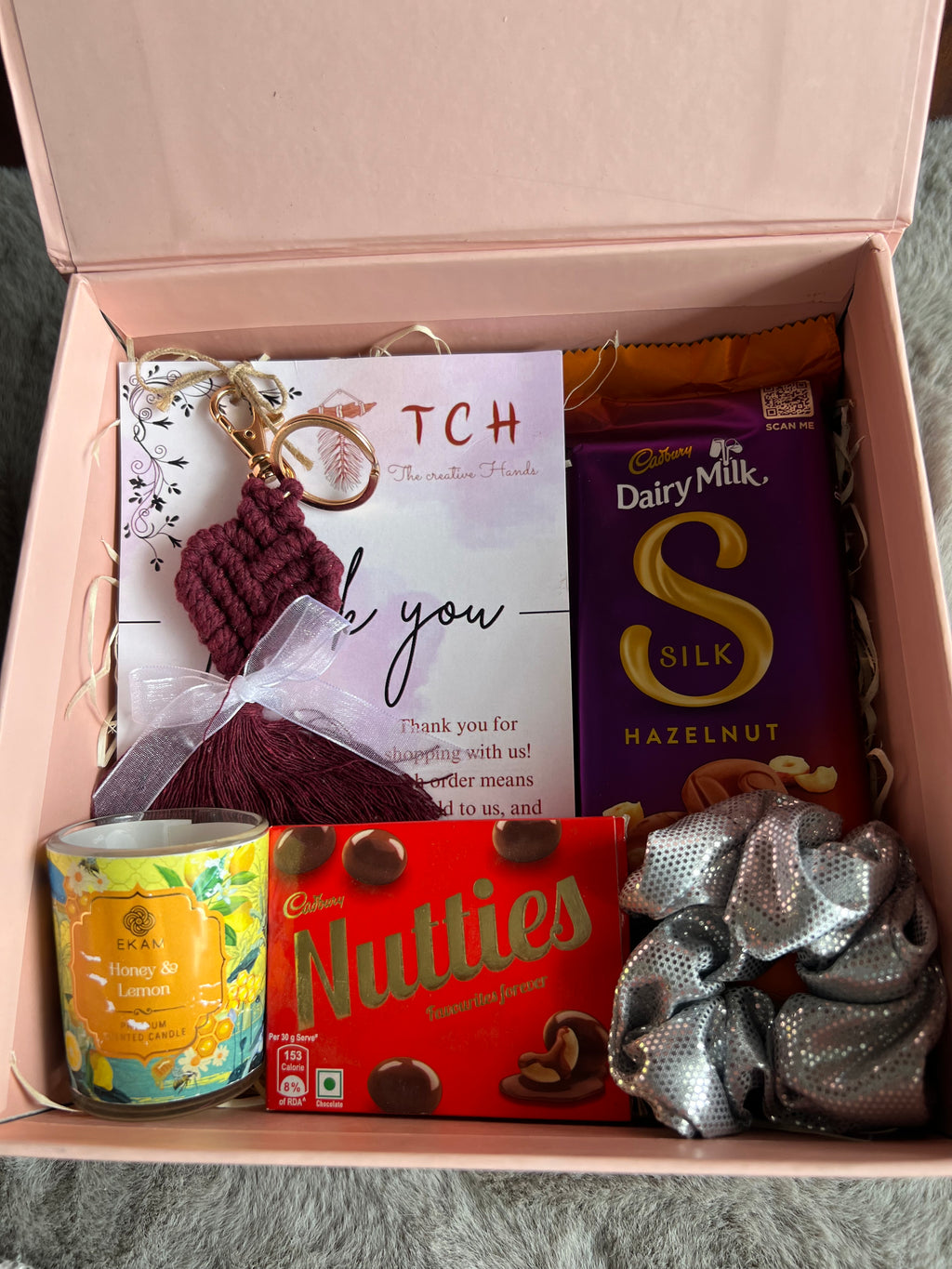 Chic Sister Rakhi Hamper with Crochet Keychain, Candle, Scrunchy & Chocolates in a Stylish Gift Box