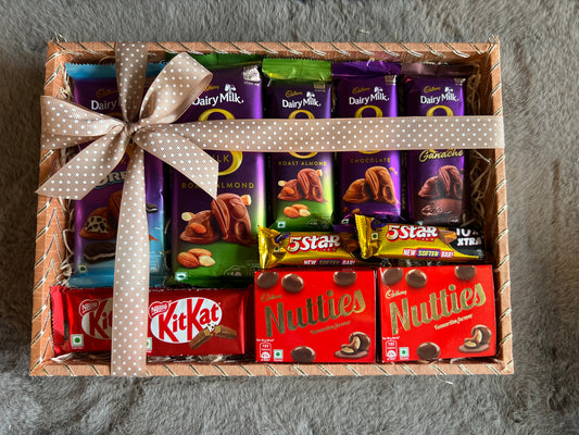 Ultimate Chocolate Indulgence Rakhi Hamper with Dairy Milk Silk, Kit Kat, Nutties & More in a Wooden Basket