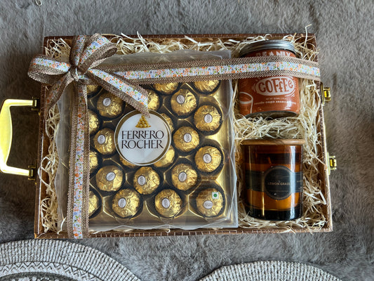 Elegant Indulgence Rakhi Hamper with Ferrero Rocher, Coffee & Candle in a Wooden Basket