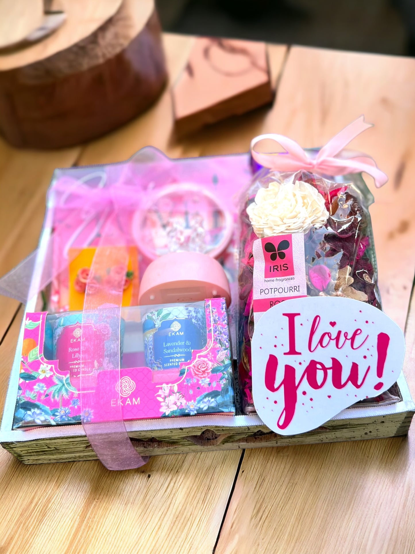 Rustic Elegance Wooden Tray Hamper: Candle, Potpourri, Showpiece, Earrings, and Chocolate