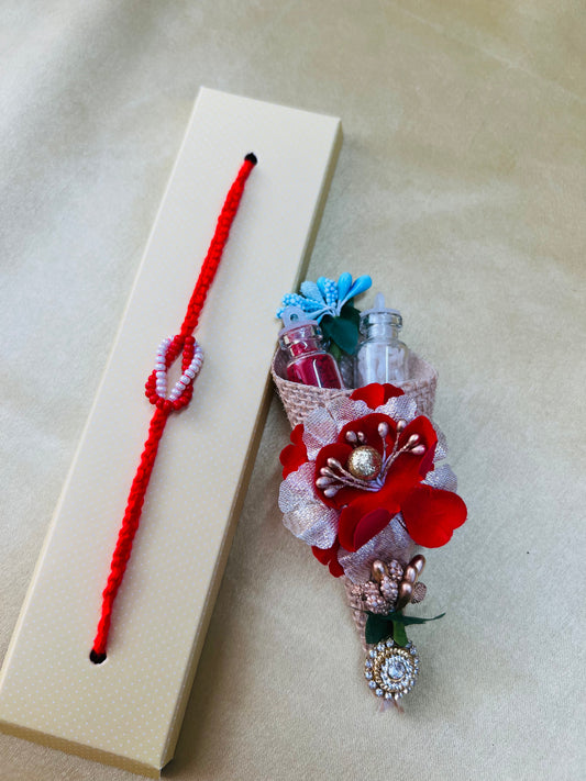 Wrap Shap RM801: Designer Beaded Rakhi with Red & White Infinity Symbol and Roli Chawal