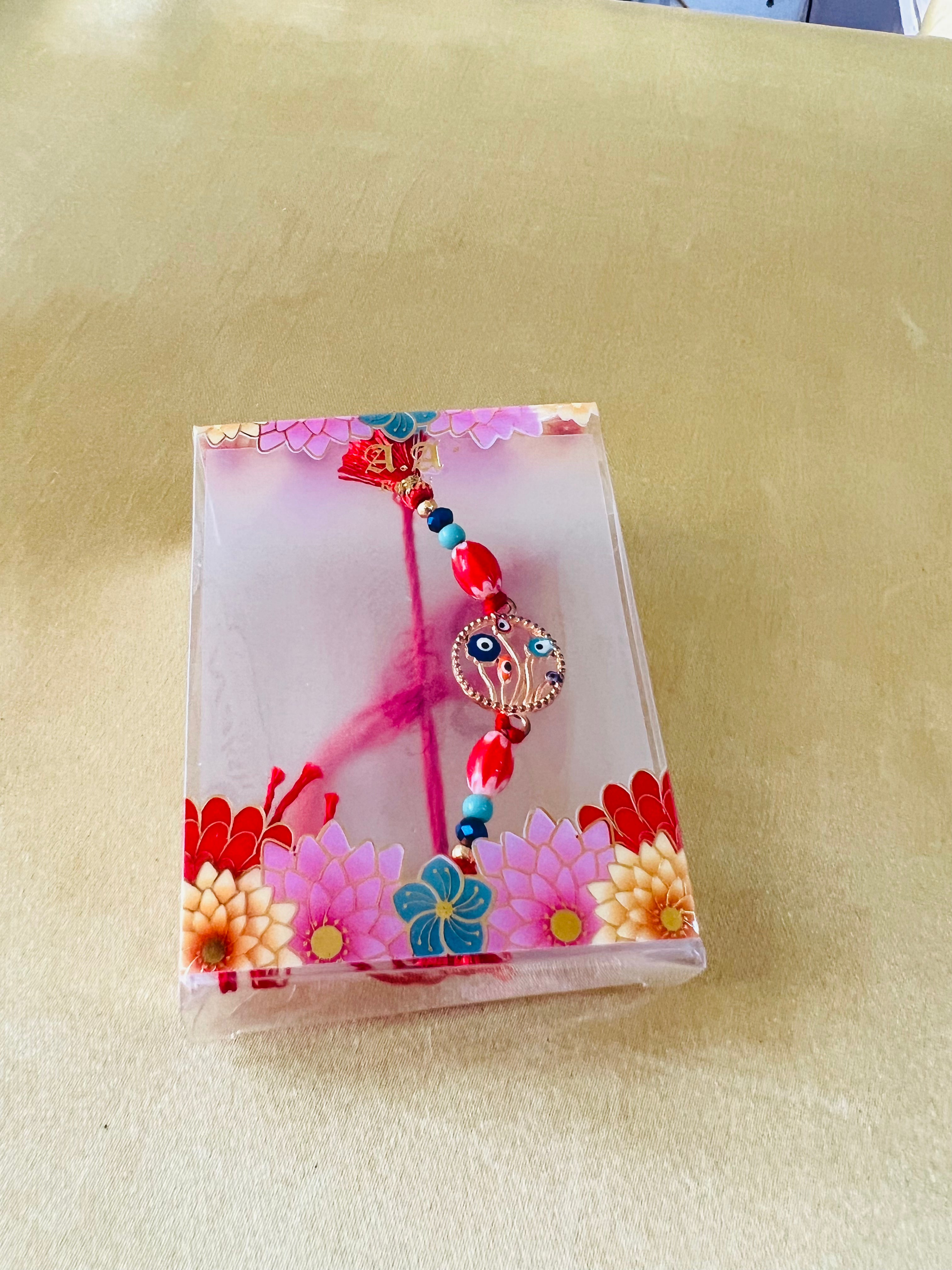 Wrap Shap BR-0107: Designer Rakhi with Evil Eye Protector and Beads, Roli Chawal Included