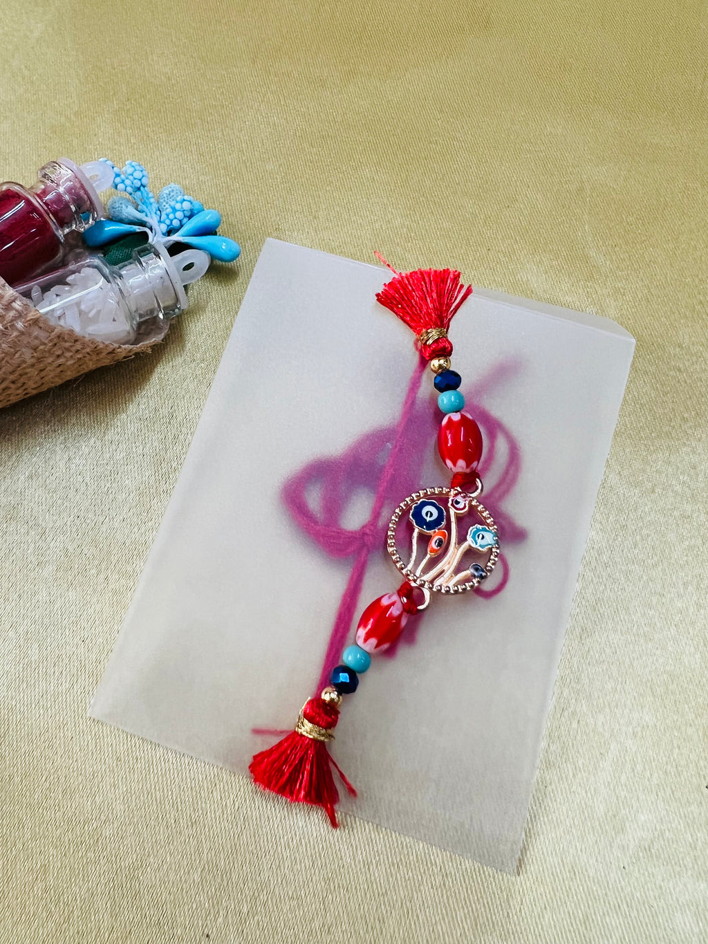 Wrap Shap BR-0107: Designer Rakhi with Evil Eye Protector and Beads, Roli Chawal Included