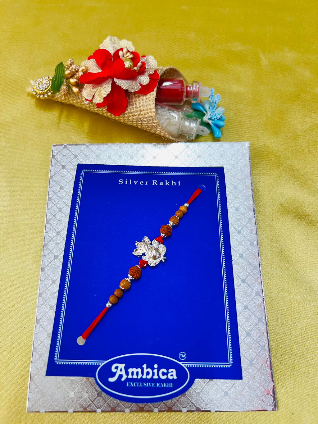 Wrap Shap Designer Rakhi with Silver Polished Ganesh, Beads, and Roli Chawal