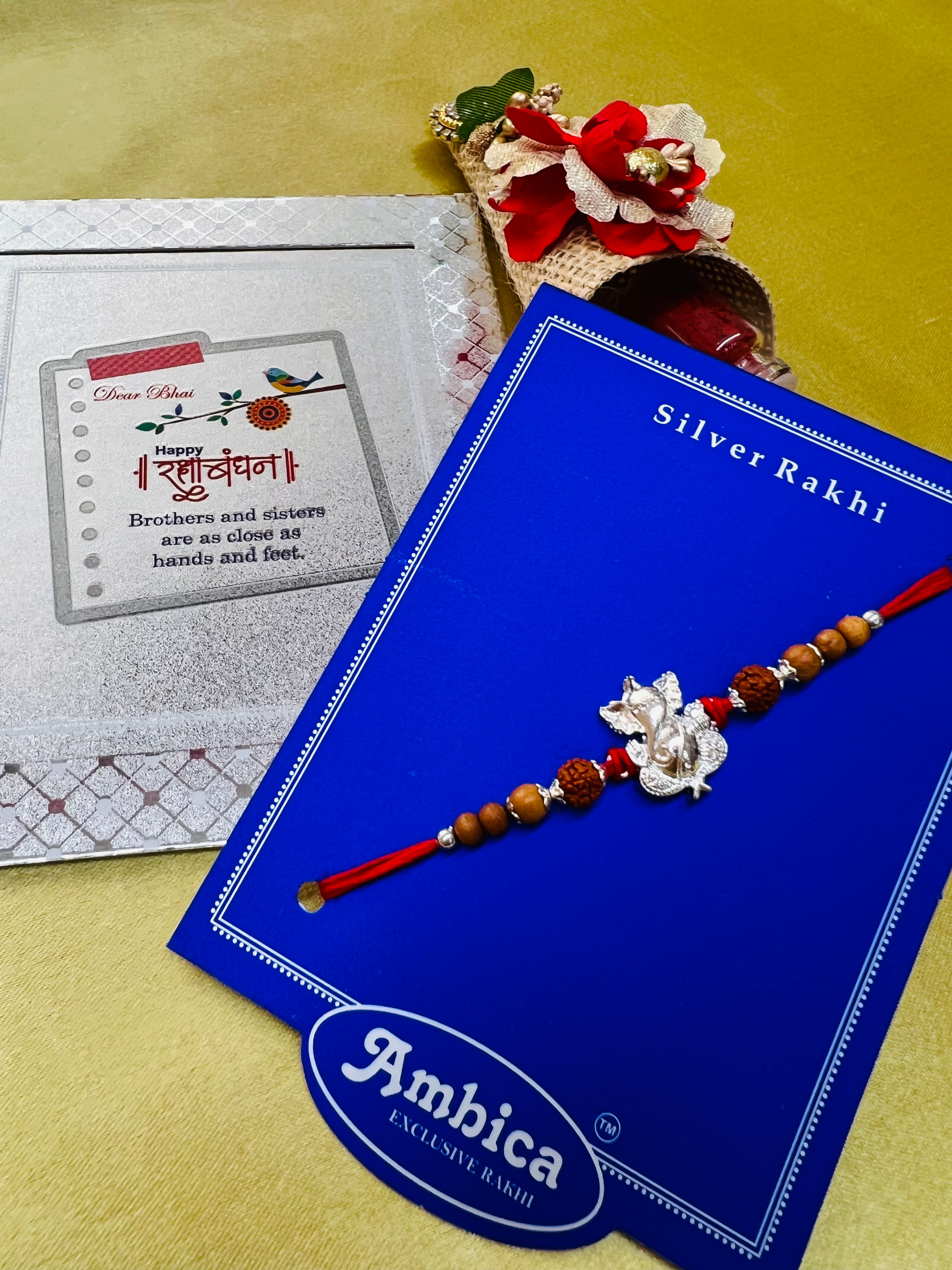 Wrap Shap Designer Rakhi with Silver Polished Ganesh, Beads, and Roli Chawal