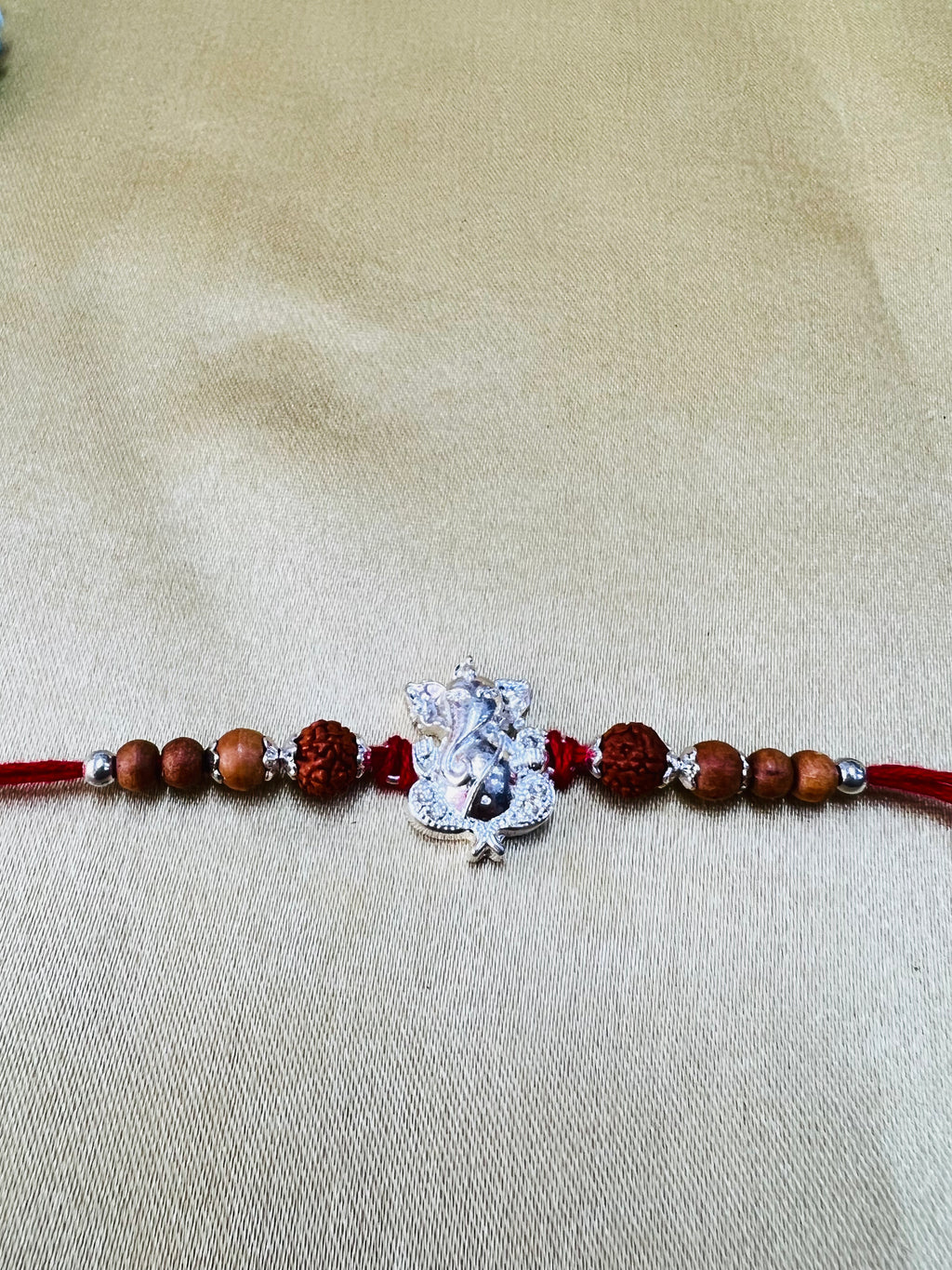 Wrap Shap Designer Rakhi with Silver Polished Ganesh, Beads, and Roli Chawal