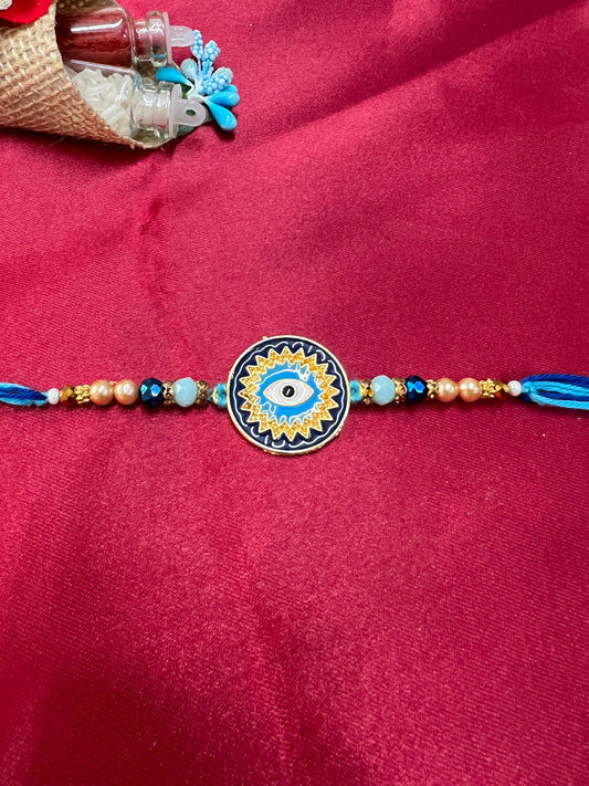 Wrap Shap KG476: Designer Rakhi with Evil Eye Design and Beads, Roli Chawal Included