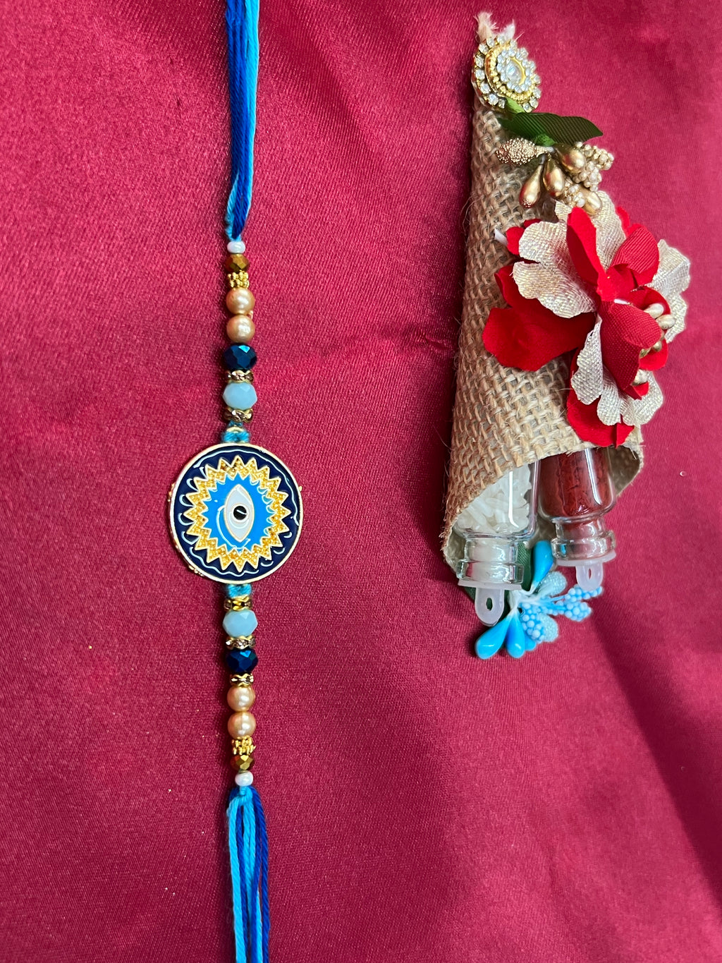 Wrap Shap KG476: Designer Rakhi with Evil Eye Design and Beads, Roli Chawal Included