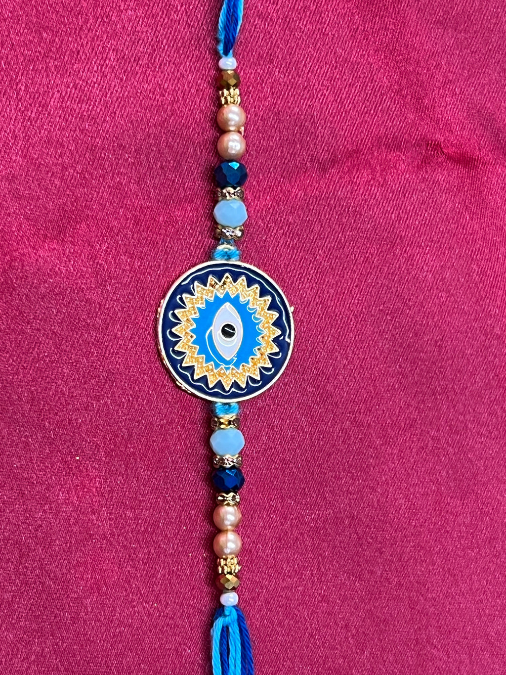 Wrap Shap KG476: Designer Rakhi with Evil Eye Design and Beads, Roli Chawal Included