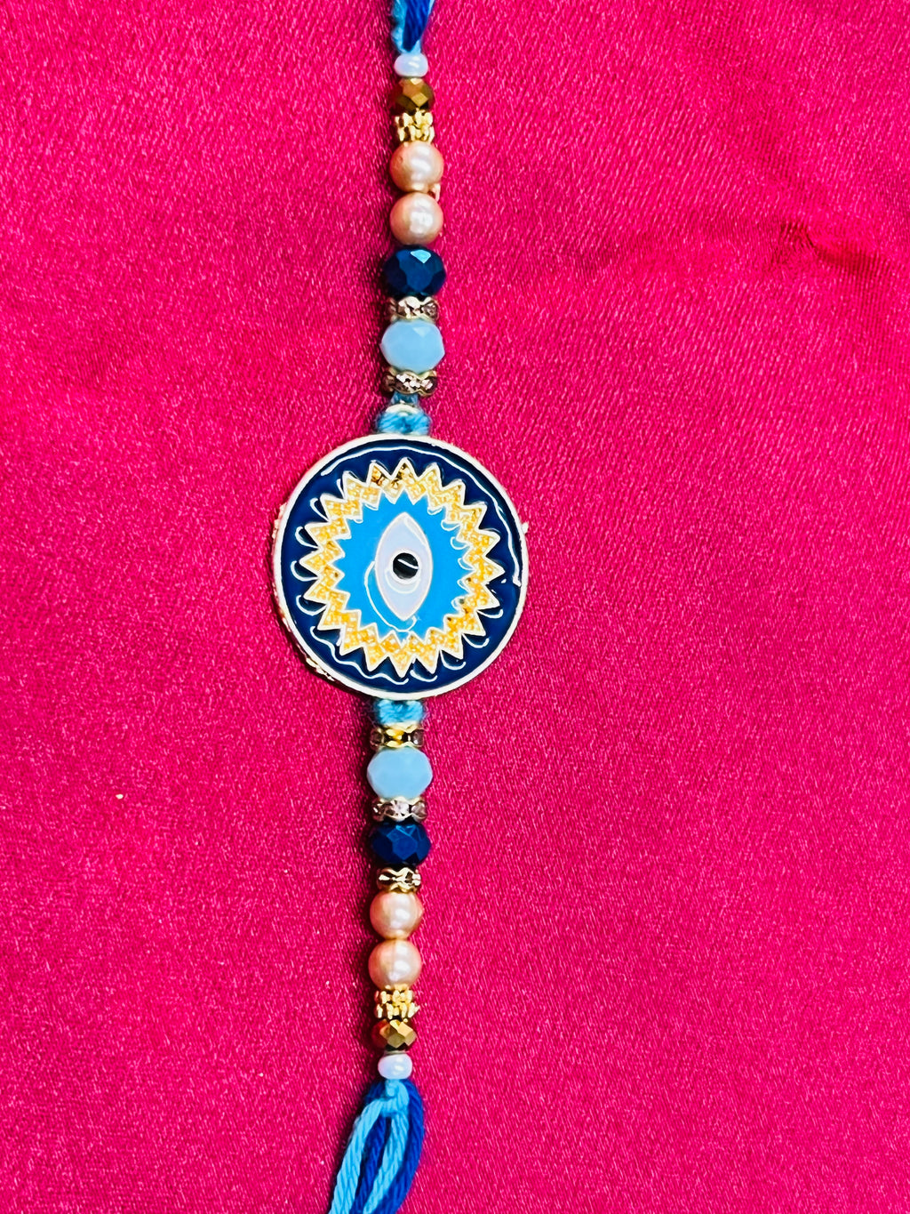 Wrap Shap KG476: Designer Rakhi with Evil Eye Design and Beads, Roli Chawal Included
