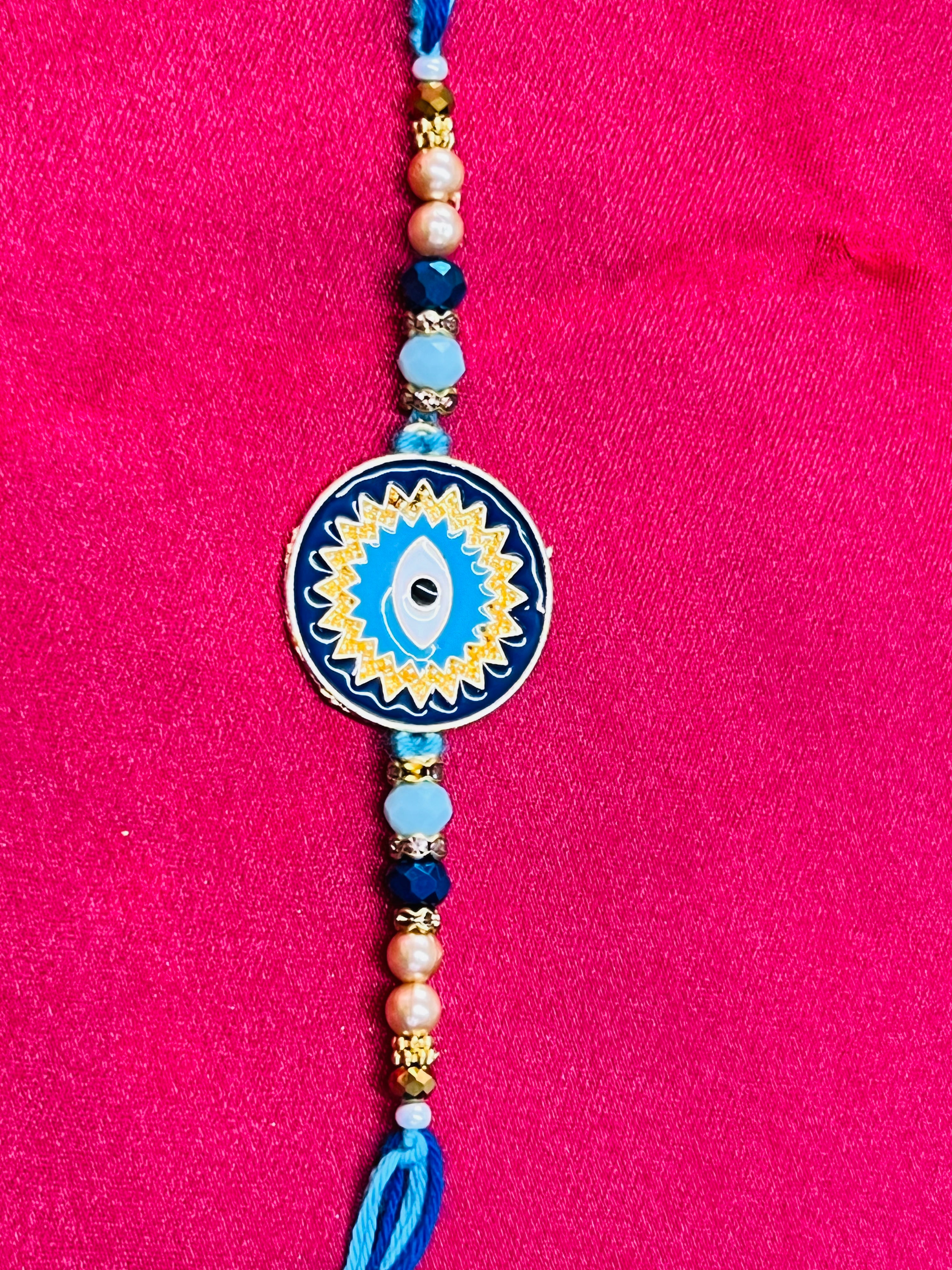 Wrap Shap KG476: Designer Rakhi with Evil Eye Design and Beads, Roli Chawal Included