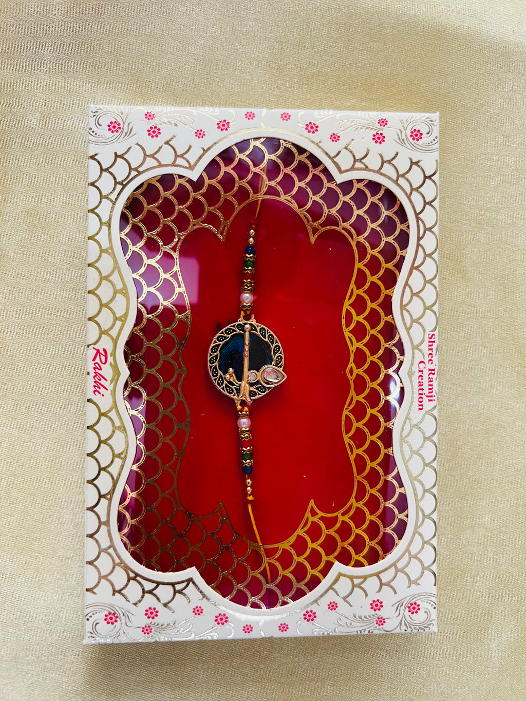 Wrap Shap GG01: Designer Rakhi with Peacock Feather and Krishna Flute Design, Roli Chawal Included
