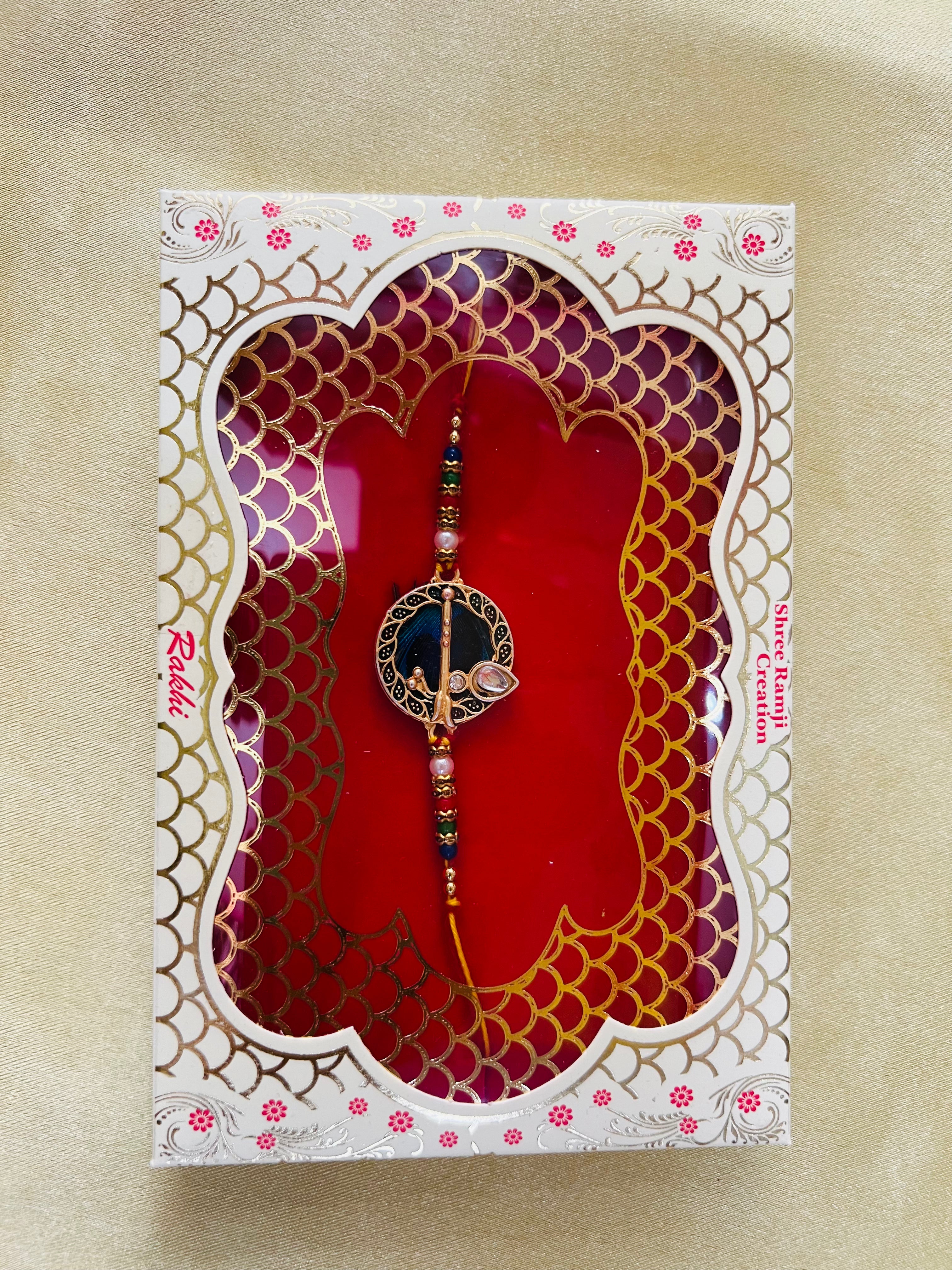 Wrap Shap GG01: Designer Rakhi with Peacock Feather and Krishna Flute Design, Roli Chawal Included