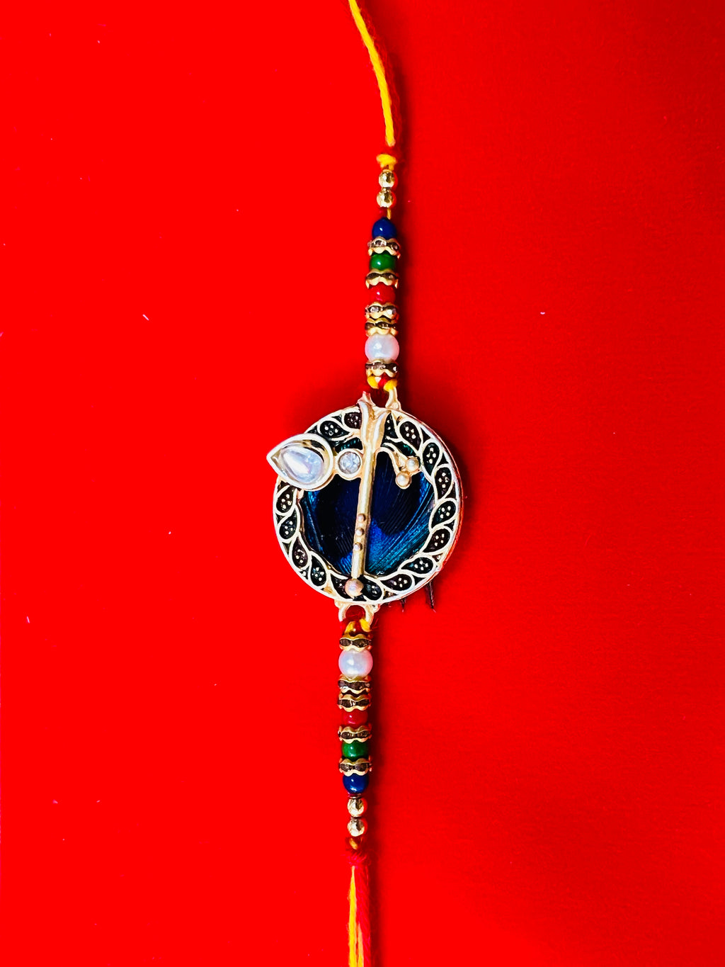 Wrap Shap GG01: Designer Rakhi with Peacock Feather and Krishna Flute Design, Roli Chawal Included