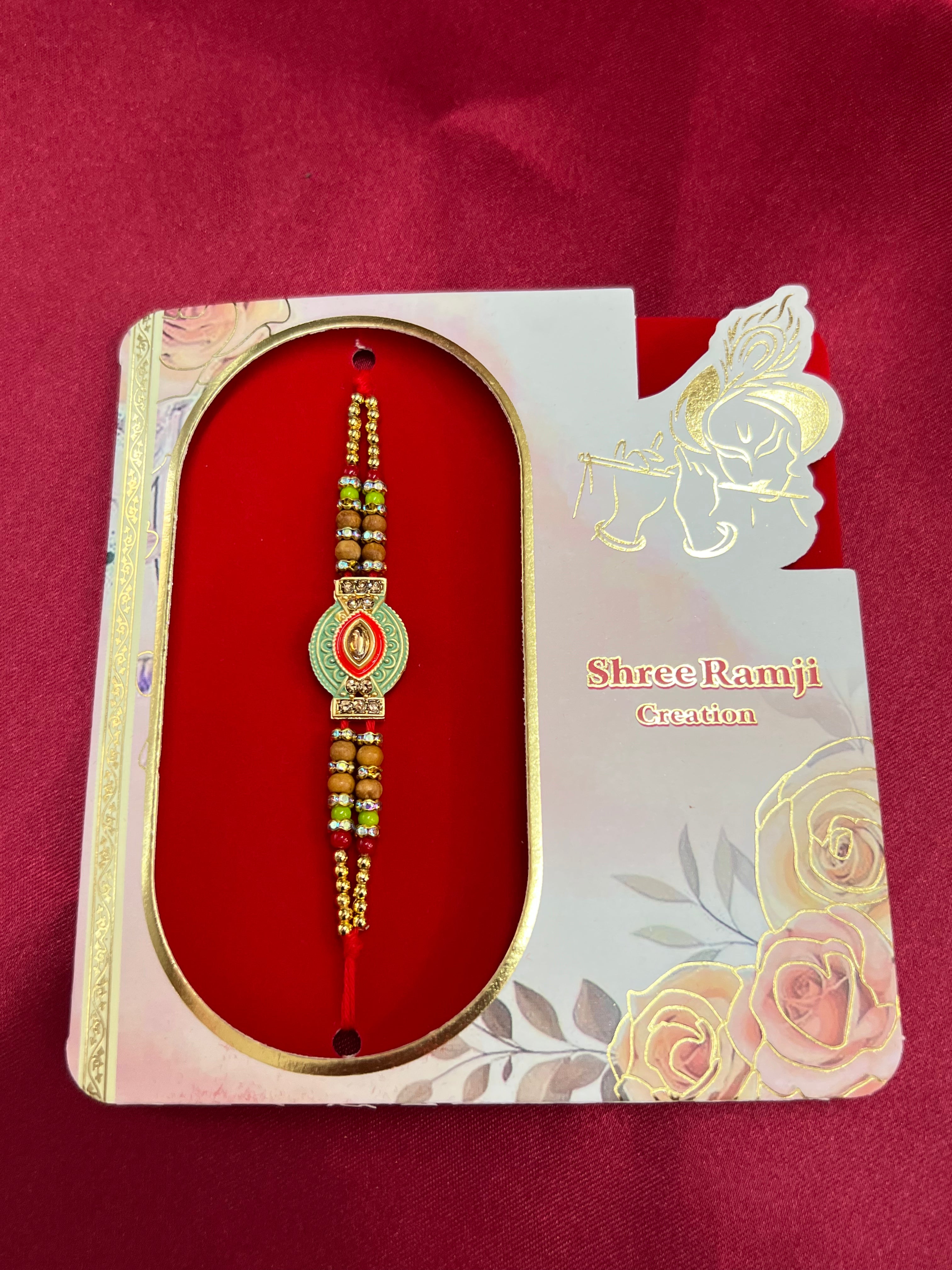 Wrap Shap EE51: Designer Rakhi with Veera, Green Bead, other Designs, Roli Chawal Included