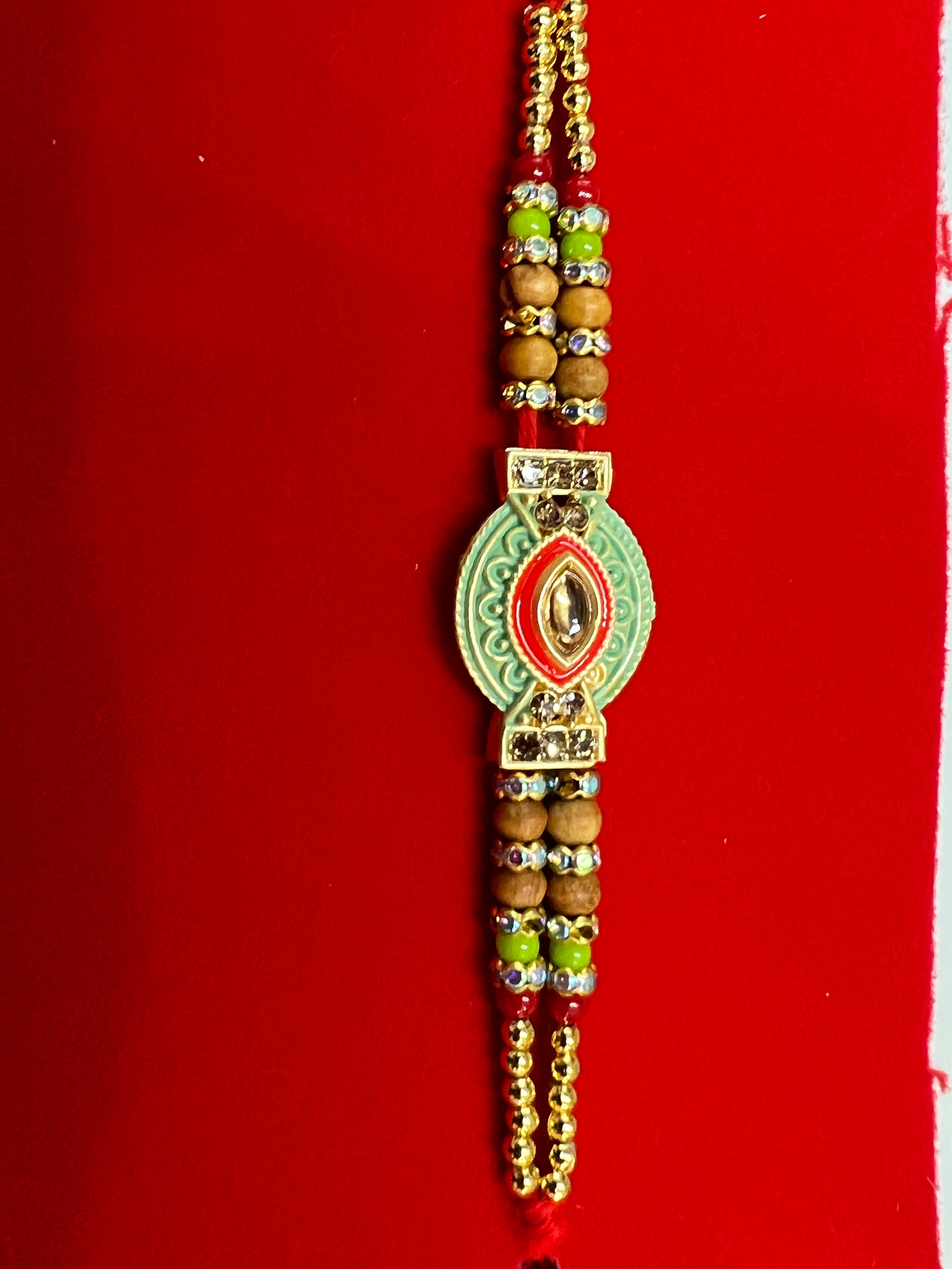 Wrap Shap EE51: Designer Rakhi with Veera, Green Bead, other Designs, Roli Chawal Included