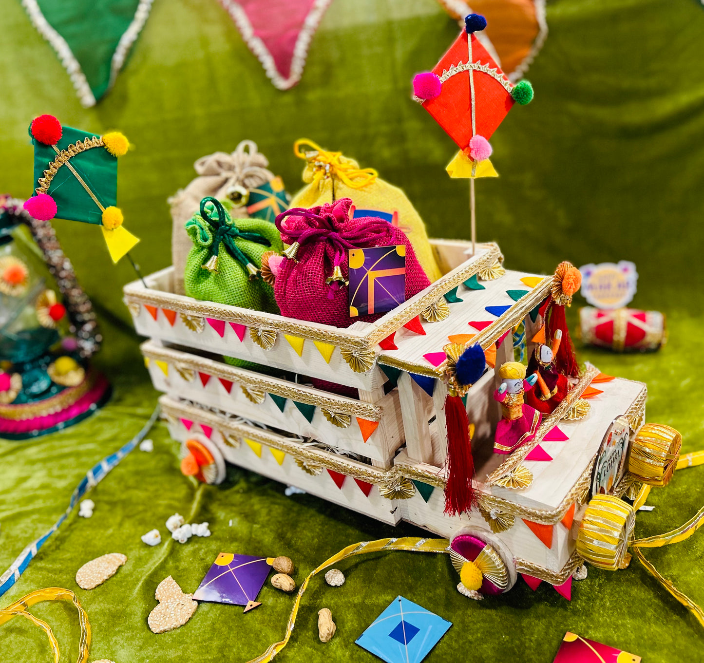 Unique Lohri Hamper in a Decorated Truck-Shaped Basket with Gajak, Revdi, Moongfali, Til Gajak & Instant Popcorn
