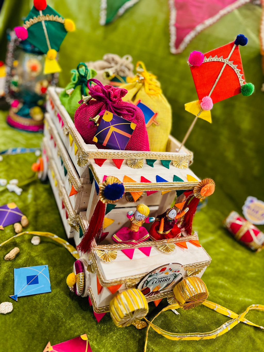 Unique Lohri Hamper in a Decorated Truck-Shaped Basket with Gajak, Revdi, Moongfali, Til Gajak & Instant Popcorn