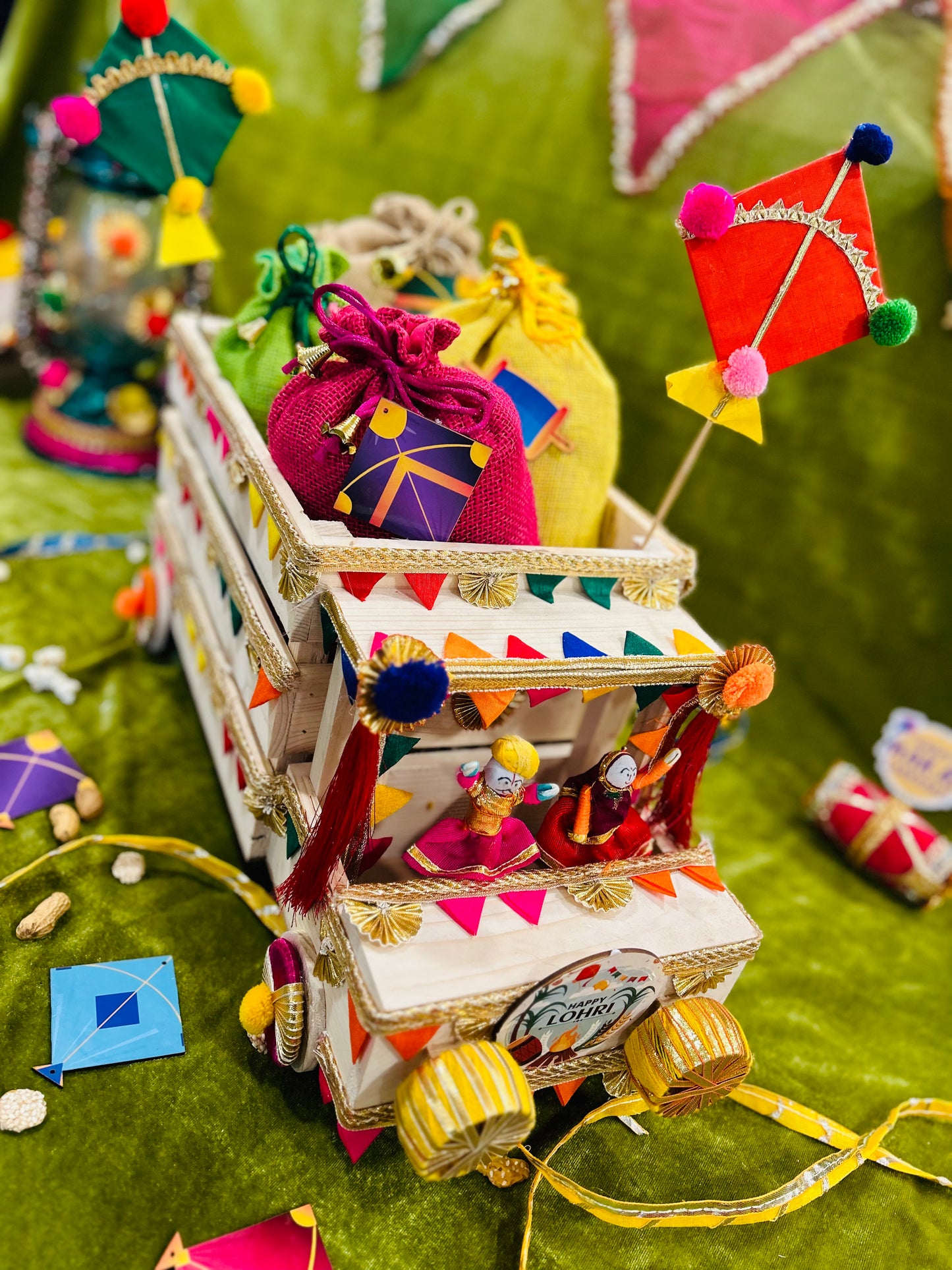 Unique Lohri Hamper in a Decorated Truck-Shaped Basket with Gajak, Revdi, Moongfali, Til Gajak & Instant Popcorn